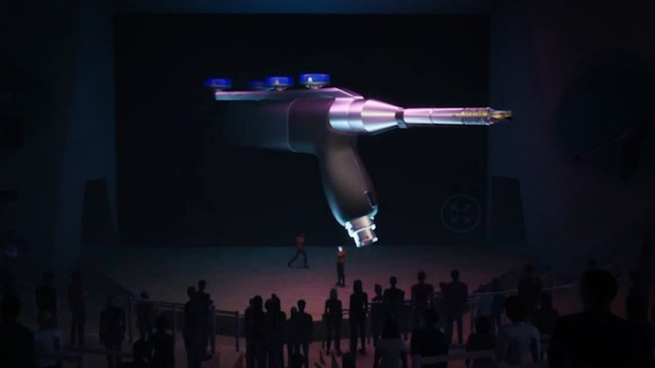 An immersive virtual environment on Meadow by Bizzlogic, featuring a large 3D projection of a medical device in front of an audience. This metaverse platform supports seamless integration with Unreal Engine and other 3D design tools, allowing users to create high-quality, accessible virtual worlds for diverse applications, including product showcases, virtual events, and training.